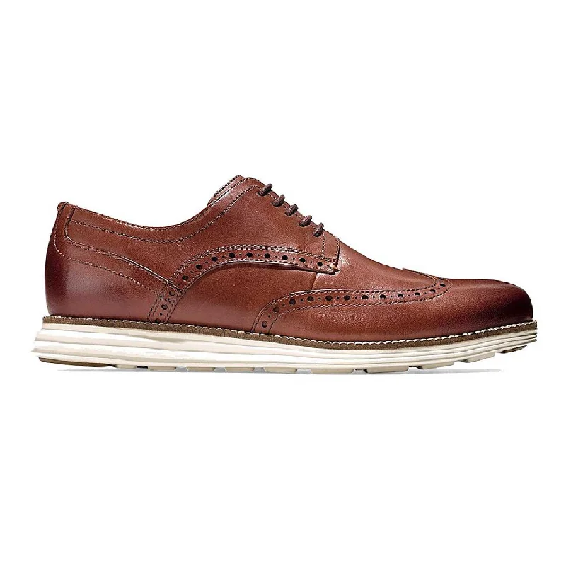 Men's Oxford shoes with a wingtip design and leather soleCole Haan Men's Original Grand Wingtip Oxford Tan